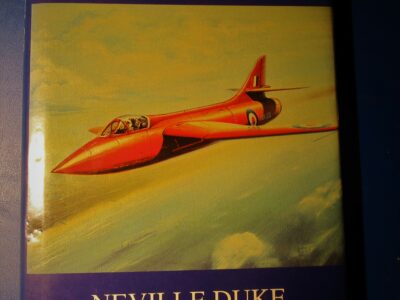 Cover of book ‘Test Pilot’ by Neville Duke, with colour drawing of orange jet plane in flight