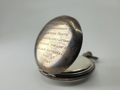 Silver watch case with long inscription